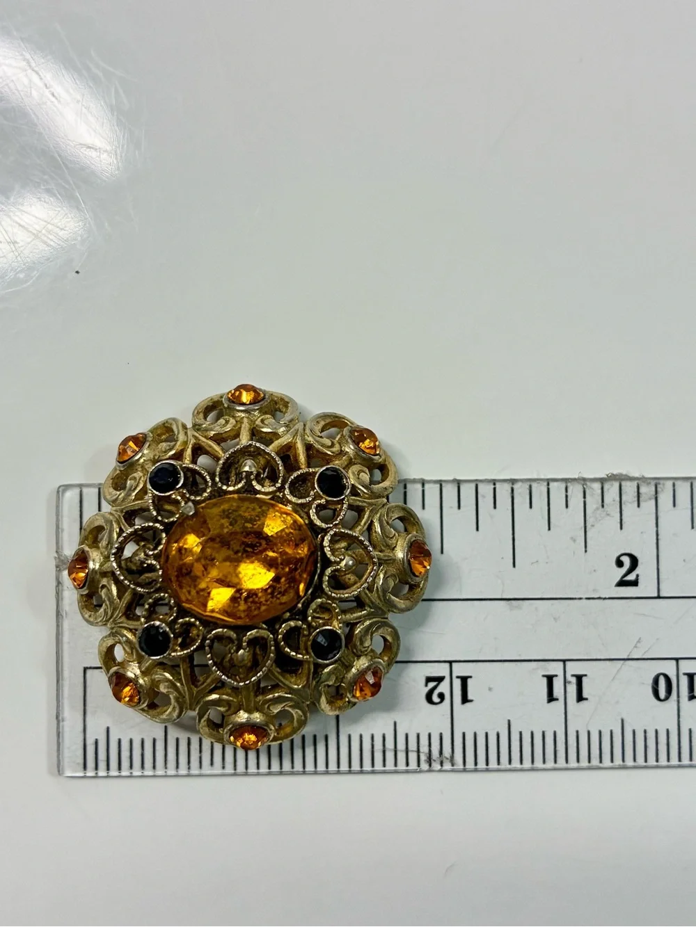 Coro Gold-Tone Heart Shaped Ornate Filigree Brooch with Amber and Black Stones